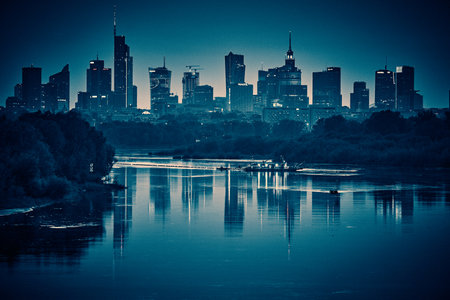 Beautiful panoramic aerial drone view of skyscrapers panorama at sunset, with reflection in Vistula river, Warsaw, Poland, EU.の写真素材
