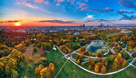 A beautiful panoramic aerial drone view of the sunset at Pola Mokotowskie in Warsaw, Poland - "Mokotow Field" is a large park in Warsaw - Is called "Jozef Pilsudski Park" or "Warsaw Central Park", EUの写真素材