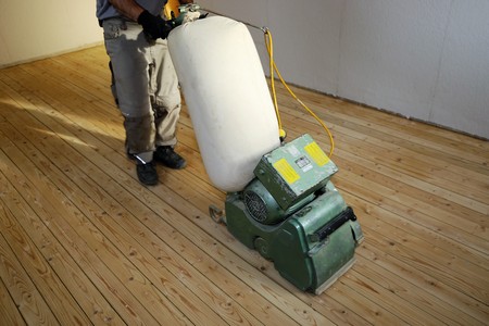 Grinding a plank floorの写真素材