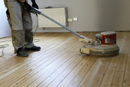 Grinding a plank floorの写真素材
