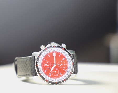 Red watch on dark backgroundの写真素材