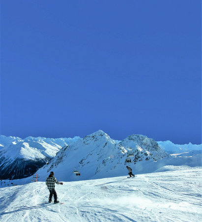 Snowboarder carving in powder