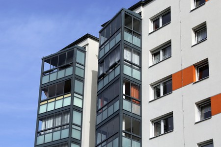 Apartment building with glazed balconiesの写真素材