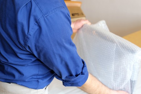 Relocation: Packing up a monitorの写真素材