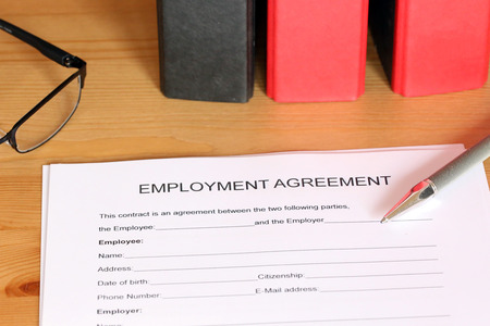 Blank form of an employment agreement on a deskの写真素材