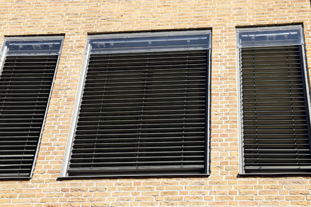 Window with modern blind, exterior shotの写真素材