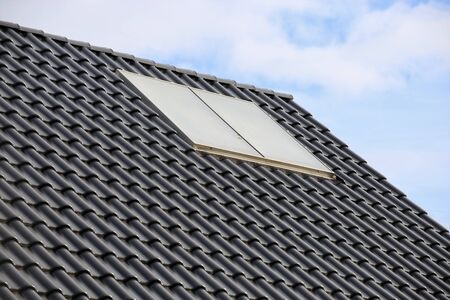 Roof with solar panels (photovoltaics)の写真素材