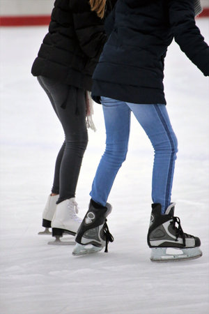 People skating on ice rink