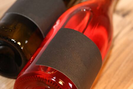 Close up of two lying wine bottlesの写真素材