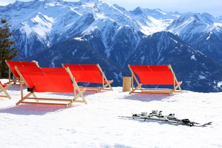 Deck chairs in a winter sports areaの写真素材