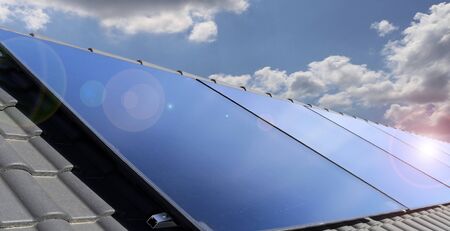 Roof with solar panels (photovoltaics)の写真素材