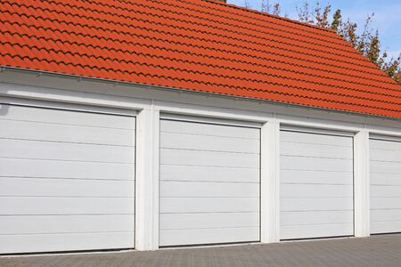 Modern white garage doors (sectional doors)の写真素材