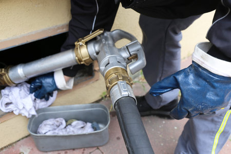 Close up of a truck delivering straight heating oil
