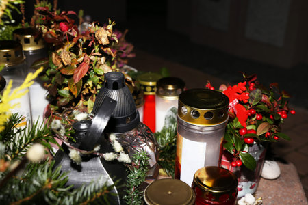 Lighting candles for the dead on All Saints Dayの写真素材