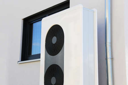 Air-conditioner on a new residential homeの写真素材