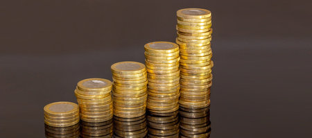 Stacked one-euro coins as a symbolic image for finance, inflation, etc.