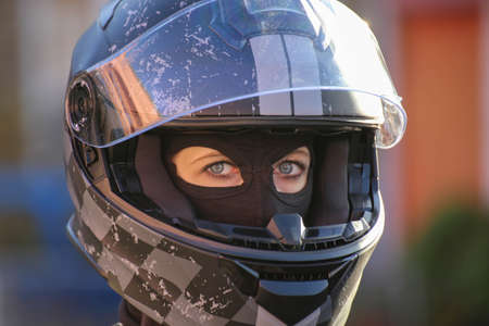 Female race car driver wears helmet and balaclava (model released)の写真素材