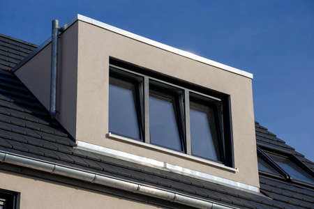 Dormer on a newly tiled roofの写真素材