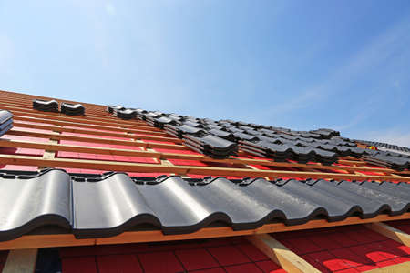 Roofing work, new covering of a tiled roofの写真素材