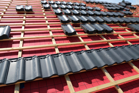 Roofing work, new covering of a tiled roofの写真素材