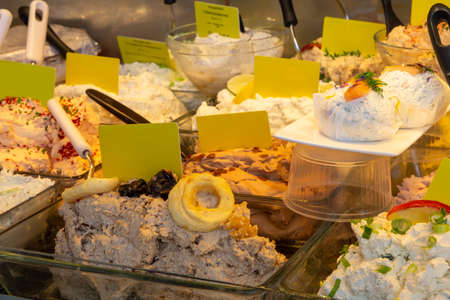 Cheese counter with different types of cream cheeseの写真素材