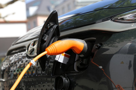 Electric car at the charging station (Kaiserslautern Germany, May 19, 2021)のeditorial素材