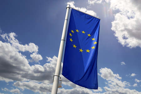 Flag of the European Union in front of a blue skyの写真素材