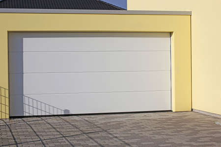 Modern white garage door (sectional door)の写真素材