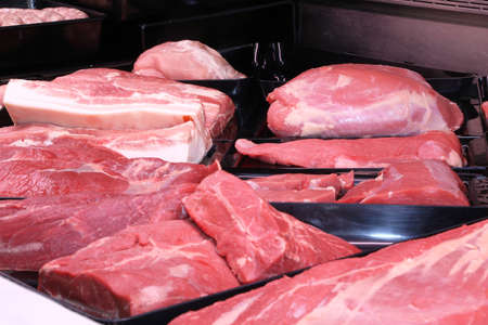 Variety of fine meat products in the butcheryの写真素材