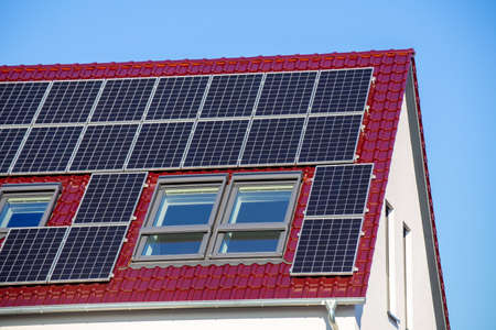 Single family house with solar system or photovoltaic systemの写真素材