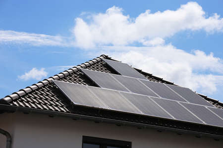 Single family house with solar system or photovoltaic systemの写真素材