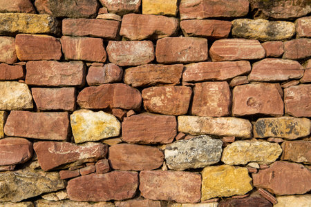 Close-up of a dry stone wall as background imageの写真素材