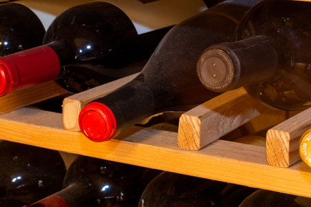 Wine cellar with bottles of red wine