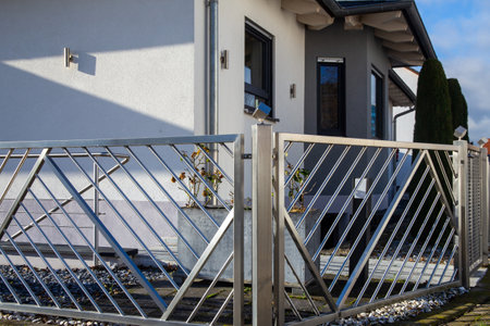 Beautiful and high-quality metal fence made of stainless steel as property boundary or garden boundaryの写真素材
