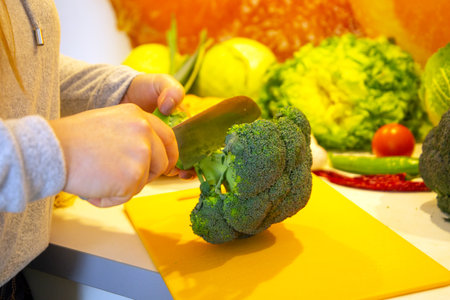 Vegan Cooking: Close-up of cutting broccoliの写真素材