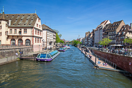 Colorful hustle and bustle along one of the many canals in Strasbourg, France (May 03, 2023)