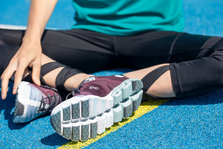 Young female athlete wears running shoes from the Swiss shoe brand ONのeditorial素材