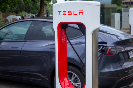 Tesla at a Supercharger in Saulce-sur-Rhone, France (June 09, 2023)のeditorial素材
