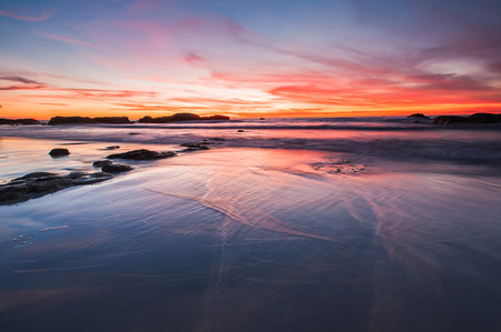 orange sunset with reflectionの写真素材