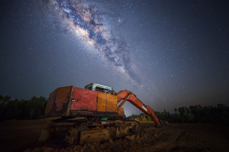 excavator working under the milky wayの写真素材