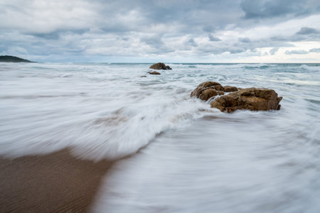 A misty seascape photographed on a cloudy, stormy day near the Marina beach in South Africa.