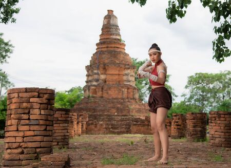 Thai Boxing Women prepare to training boxing and kickboxing for exercise at the old temple.の写真素材