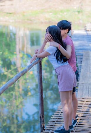 Attractive young Asian women LGBT lesbian couple moments romantic and happiness with lens flare.の写真素材