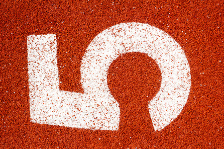 Number five on the start of a running track - check my portfolio for other numbersの写真素材