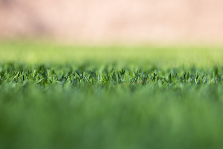 Artificial grass and the sun light as a backgroundの写真素材