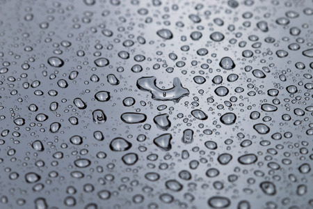 water drops on silver backgroundの写真素材