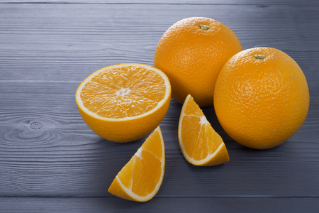 fresh orange fruit on wooden tableの写真素材