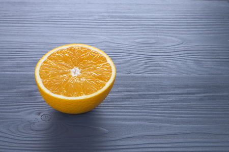 fresh orange fruit on wooden tableの写真素材