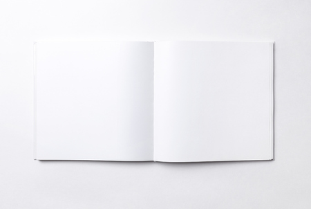 Blank open book on white, top viewの写真素材