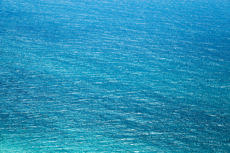 The texture of the water surface with slight ripples. Sea of denim colorの写真素材
